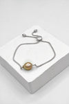  Ricki Goldstein bracelet avec une perle pêche