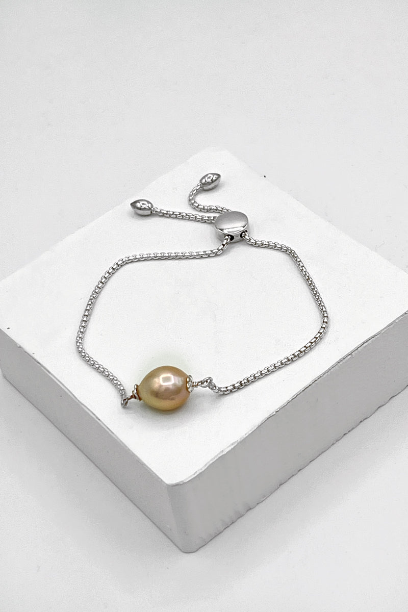  Ricki Goldstein bracelet avec une perle pêche