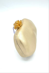 Tres Chic Oval Clutch Champagne Gold