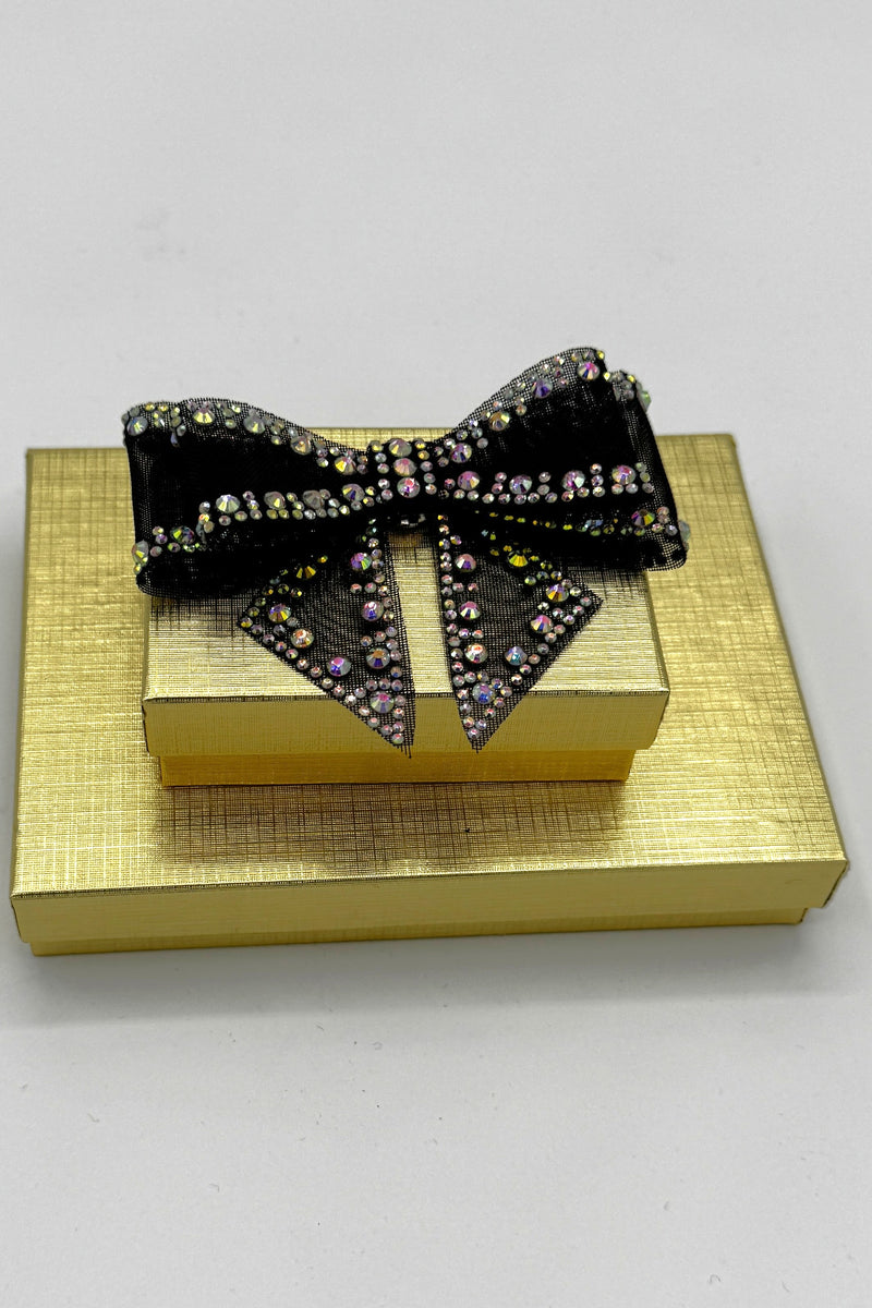 Broche en forme d'arc en cristal